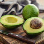 Fresh avocado on cutting board