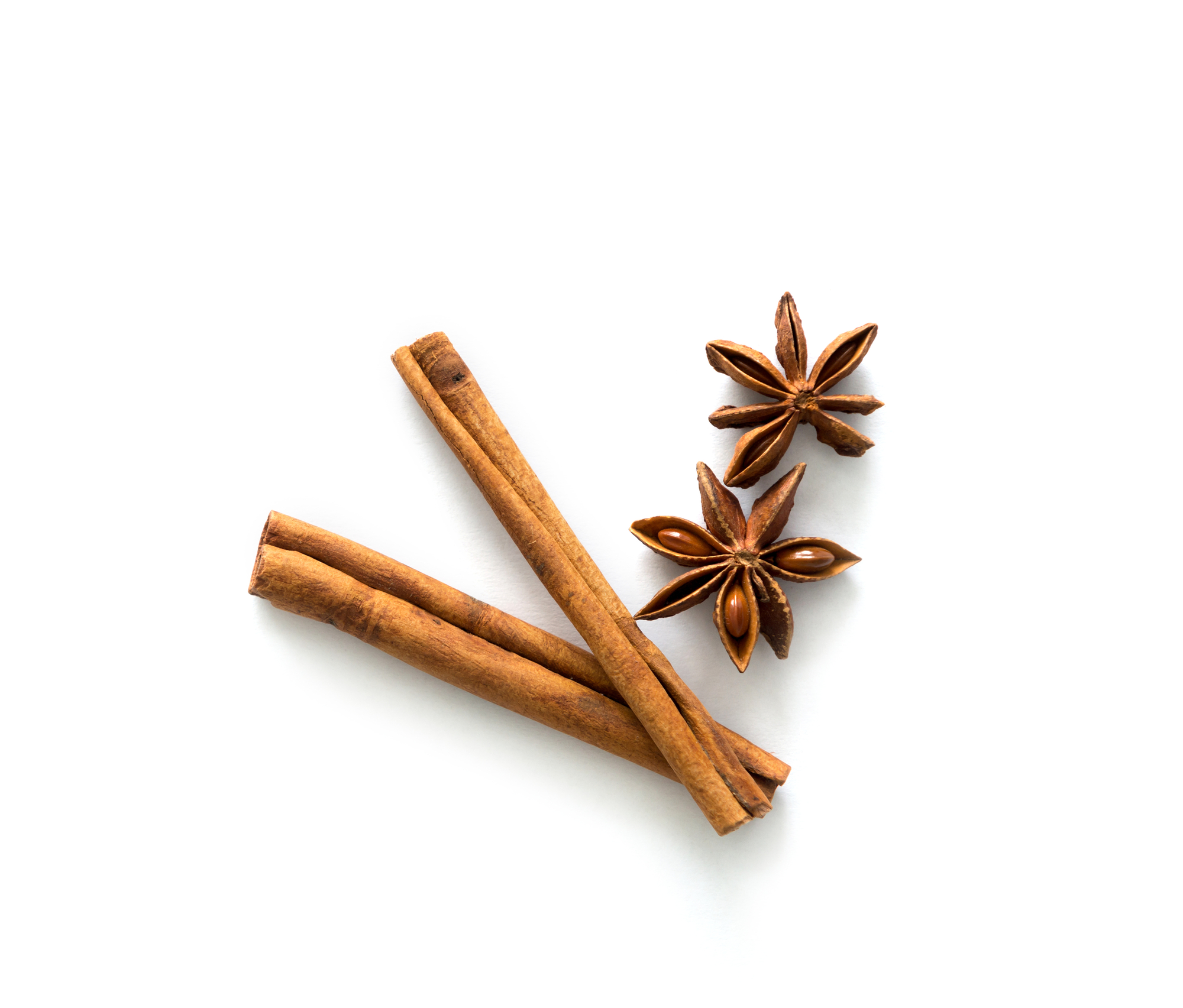 Two cinnamon sticks lying on table