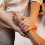 girl having massage for her legs