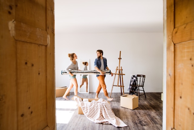 Young married couple moving in new house