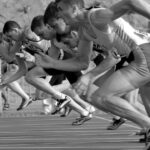 Athletes - Athletes Running on Track and Field Oval in Grayscale Photography