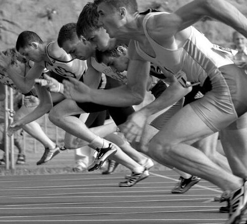 Athletes - Athletes Running on Track and Field Oval in Grayscale Photography