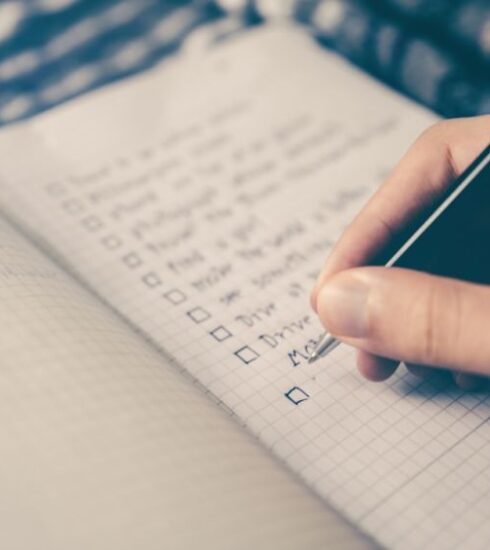 Nutrition Plan - person writing bucket list on book