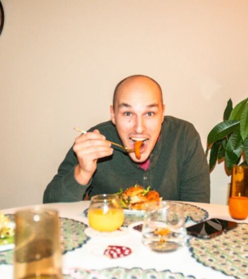 Meals - a man sitting at a table with a plate of food in front of him