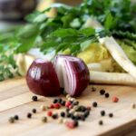 Nutrition - red onion on brown wooden chopping board