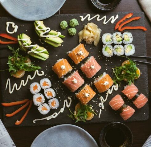 Nutrition - sushi on black ceramic plate