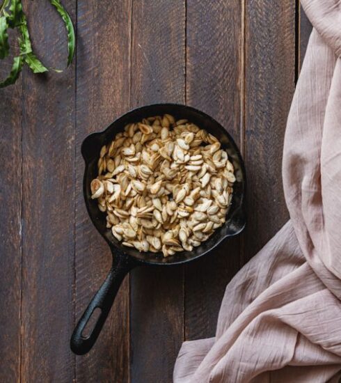 Nutrition - black cast iron pan with brown wooden handle