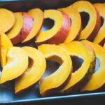 Nutrition - sliced fruit on black tray