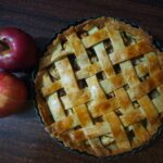 Foods - red apple beside brown pie