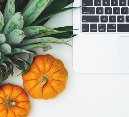 Diet - Pumpkins and Pineapple Next to Laptop