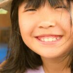 Foods - A little girl wearing a hat with a butterfly on it