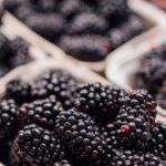 Superfoods - Blackberries and other fruits are displayed in baskets