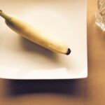 Diet - White Bread on White Ceramic Plate Beside Clear Drinking Glass