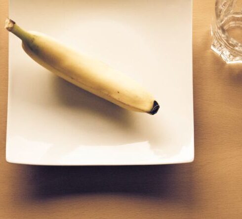 Diet - White Bread on White Ceramic Plate Beside Clear Drinking Glass