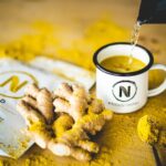 Superfoods - a cup of tea being poured into a bag of ginger