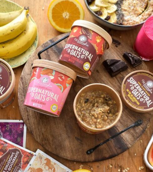 Superfoods - a wooden table topped with bowls of fruit and ice cream