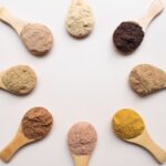 Superfoods - six different types of powdered spoons arranged in a circle