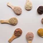 Superfoods - a group of spoons filled with different types of powder