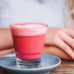 Superfoods - woman in front of drink and saucer