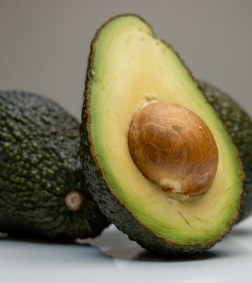 Superfoods - an avocado cut in half on a table