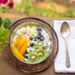 Superfoods - sliced fruit on green and brown ceramic bowl