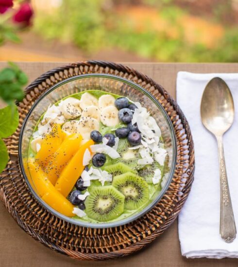 Superfoods - sliced fruit on green and brown ceramic bowl