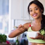 Healthy Eating - Woman Holding Gray Steel Spoon