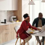 Eating - Couple Using their Laptops While Having Breakfast