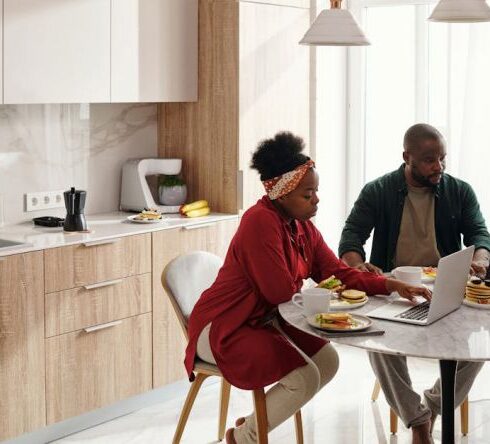 Eating - Couple Using their Laptops While Having Breakfast