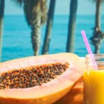 Wellness Diet - Yellow Liquid in Clear Drinking Glass With Straw on Brown Wooden Table