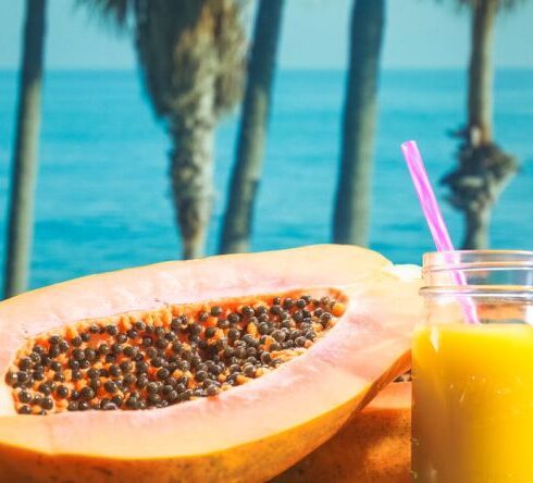 Wellness Diet - Yellow Liquid in Clear Drinking Glass With Straw on Brown Wooden Table