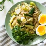 Diet - Fried Rice With Poached Egg, Zucchini, And Celery on Round Green Ceramic Plate