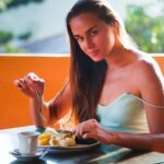 Diet - Woman Eating Breakfast