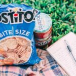 Snacks - Tostito Pack Beside Can and Notebook