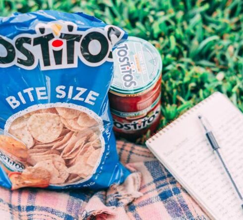 Snacks - Tostito Pack Beside Can and Notebook