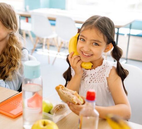 Snacks For Kids - Girls Smiling while Eating Snack during Their Break Time