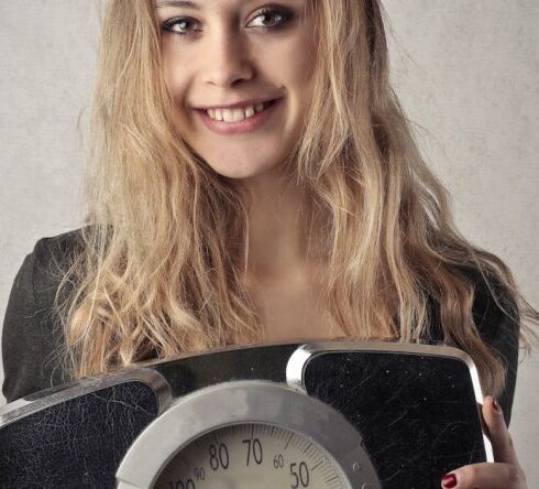 Weight Loss - Woman in Black Shirt Holding Black and Silver Weight Scale