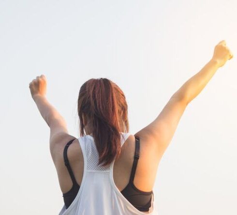 Wellness - Woman Wearing Black Bra and White Tank Top Raising Both Hands on Top