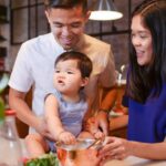 Healthy Eating - Woman in White Shirt Holding Girl in Blue Dress