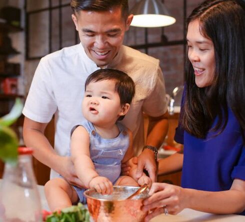 Healthy Eating - Woman in White Shirt Holding Girl in Blue Dress