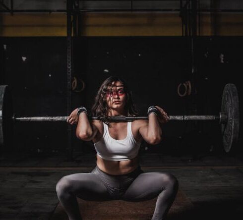 Weightlifting - Woman Lifting Barbell