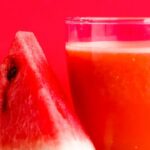 Diet - Watermelon Shake Filled Glass Cup Beside Sliced Watermelon Fruit on Brown Surface