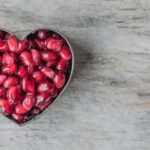 Nutrition - Silver Heart Bowl Filled of Red Pomegranate Seeds