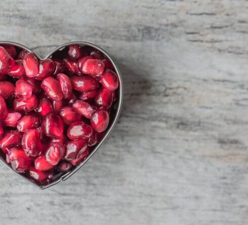 Nutrition - Silver Heart Bowl Filled of Red Pomegranate Seeds