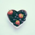 Nutrition - heart-shaped bowl with strawberries