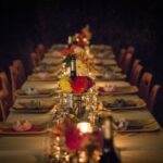 Dinner - white and green ceramic plates on brown wooden dining table