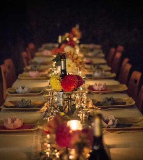 Dinner - white and green ceramic plates on brown wooden dining table