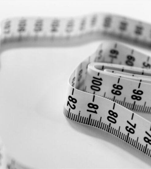 Diet - selective focus photography of tape measure