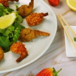 Diet - a white plate topped with shrimp and greens