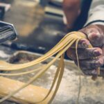 Pasta - person sheeting dough